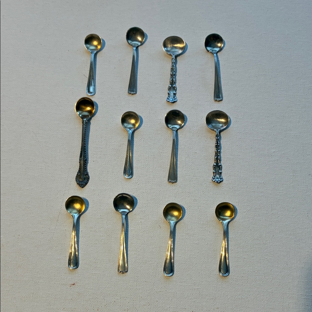 12 Sterling Salt/ Sugar Spoons. All marked Sterling